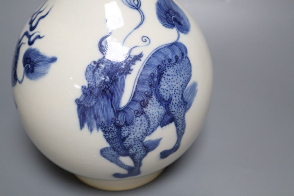 A Chinese porcelain blue and white bottle vase, painted with dragons in underglaze blue